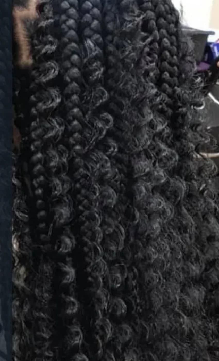Close-up of glossy braided curls from Katty Hair Studio